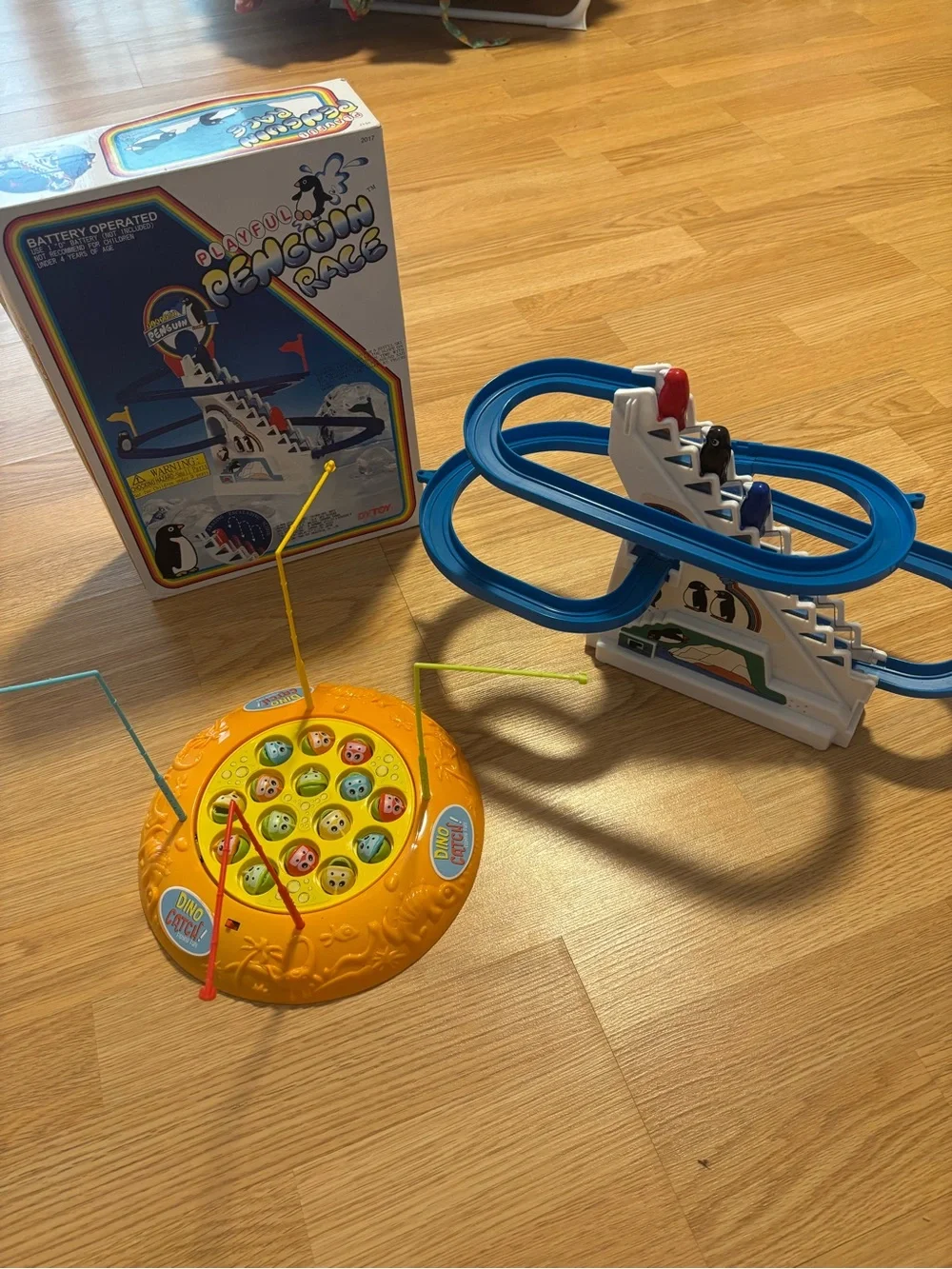 “Playful Penguin Race” and “Dino Catch” kids games in great condition